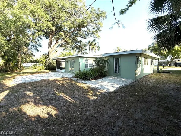 a view of a backyard of the house