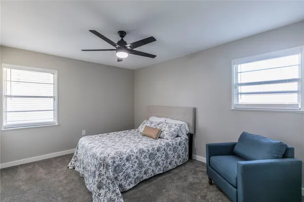 a bedroom with a bed and furniture