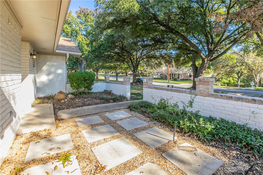 3401 Oakridge Lane Waco, TX 76708 - Photo 2 of 28 a view of a yard with plants and trees