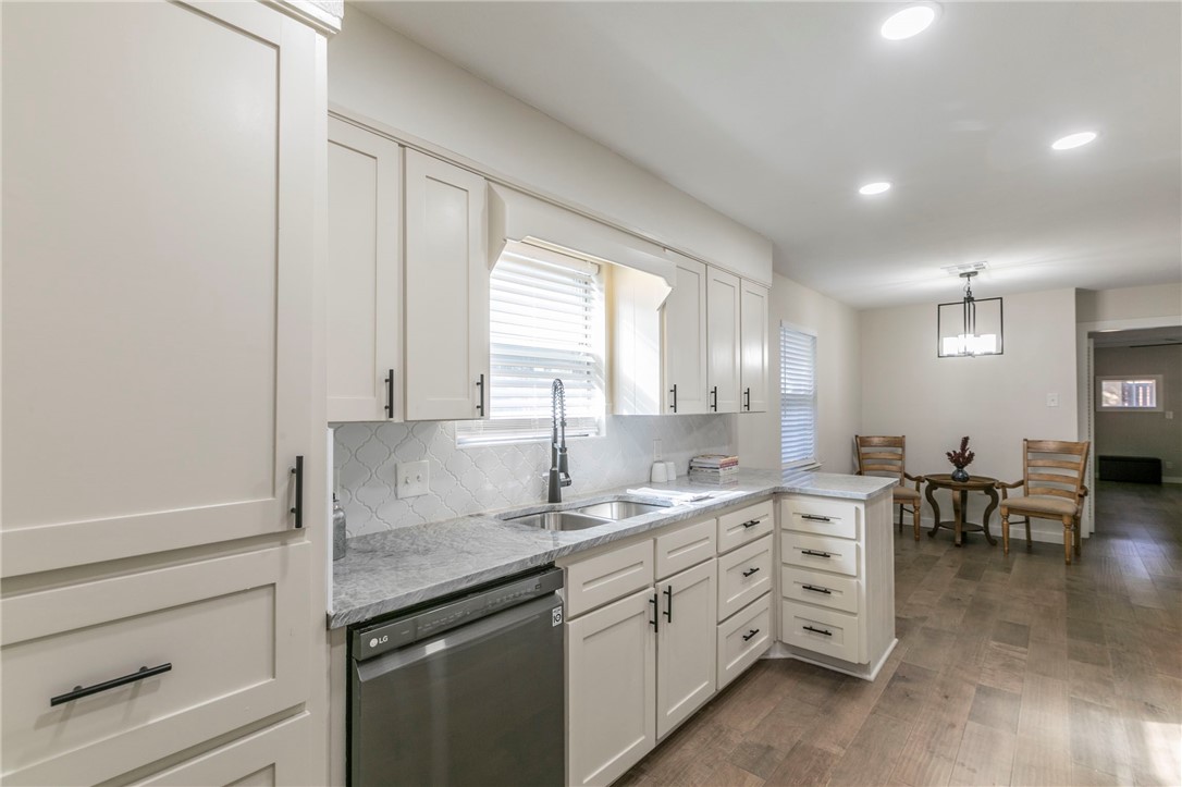 3401 Oakridge Lane Waco, TX 76708 - Photo 10 of 28 a kitchen with sink cabinets and window
