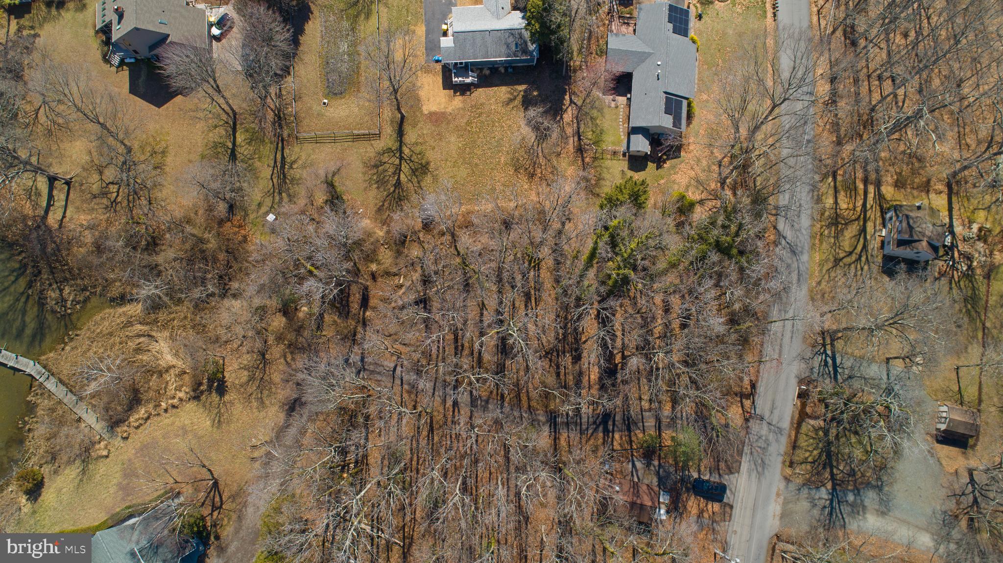 5911 Tyler Road Deale, MD 20751 - Photo 8 of 14 a aerial view of residential house with parking