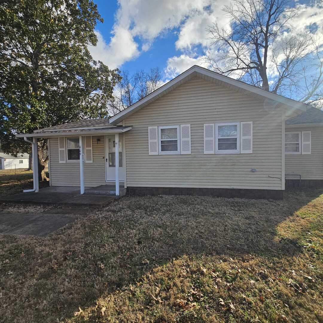 a house view with a backyard space