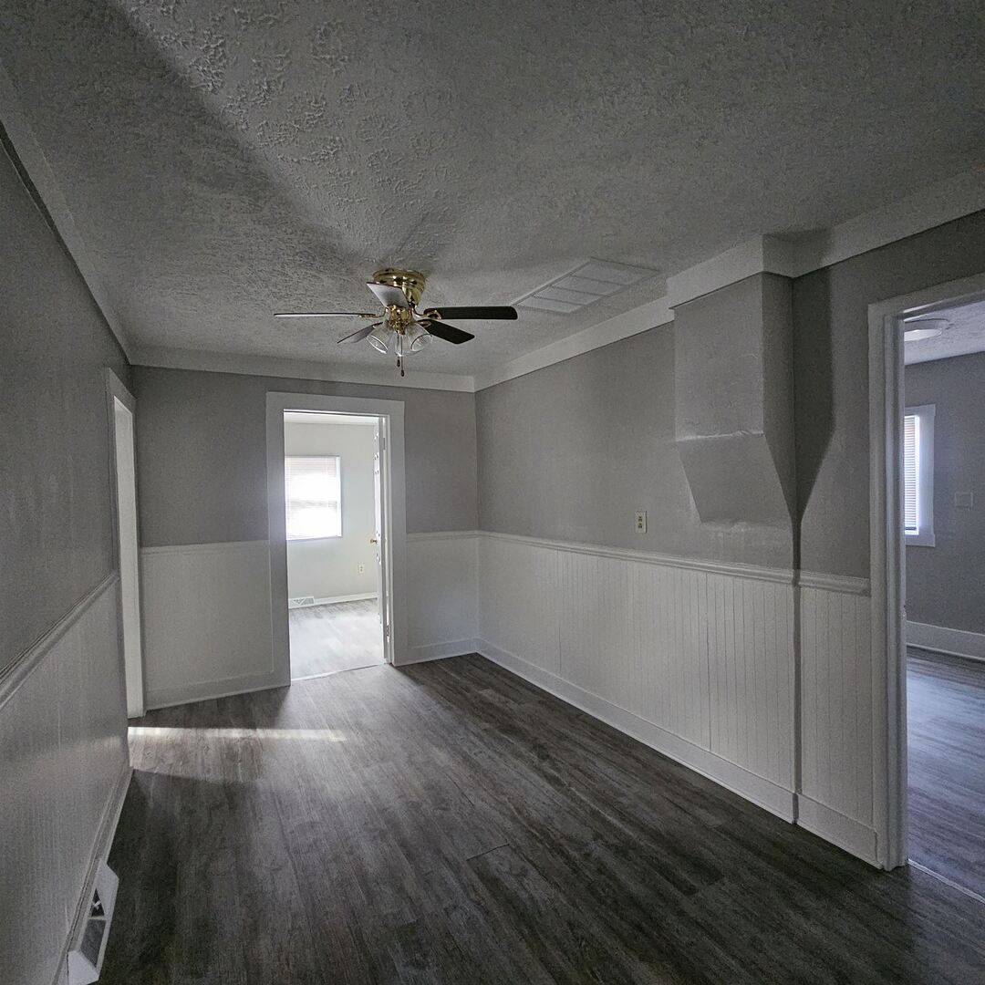 609 Airport Road Mount Vernon, IL 62864 - Photo 14 of 27 an empty room with wooden floor closet and windows