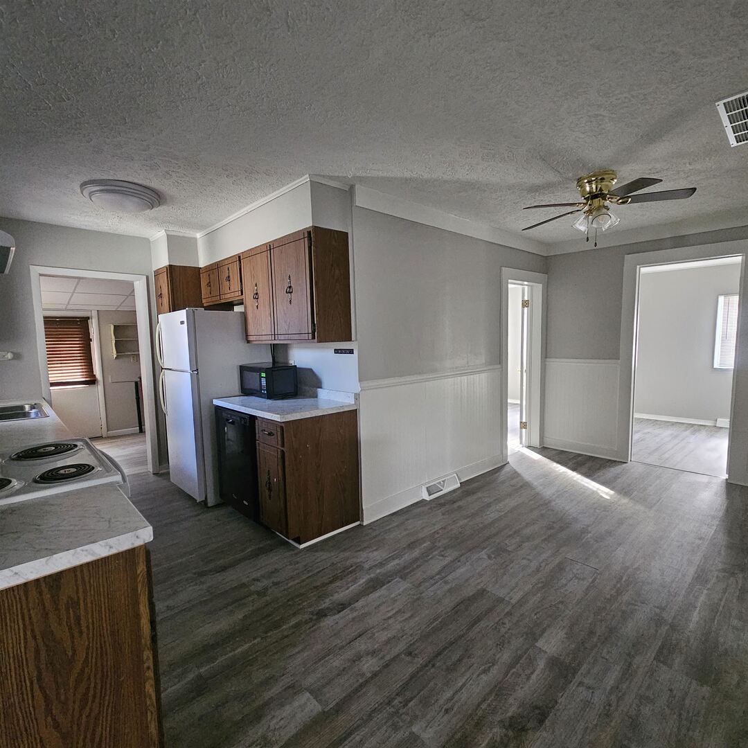 609 Airport Road Mount Vernon, IL 62864 - Photo 19 of 27 a kitchen with granite countertop a sink cabinets and stainless steel appliances