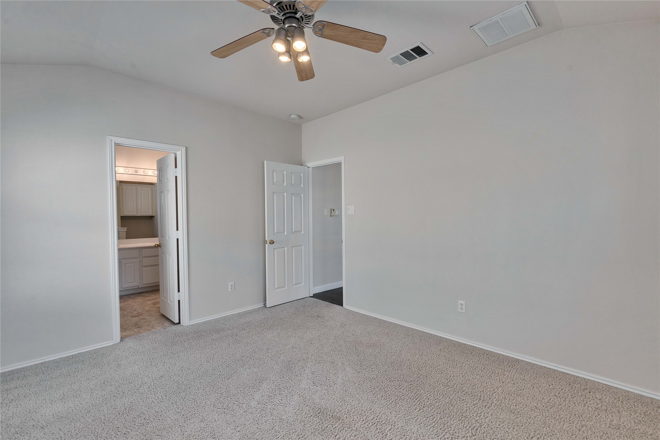 1900 Scofield Ridge Parkway, Unit 2701 Austin, TX 78727 - Photo 12 of 20 an empty room with chandelier fan