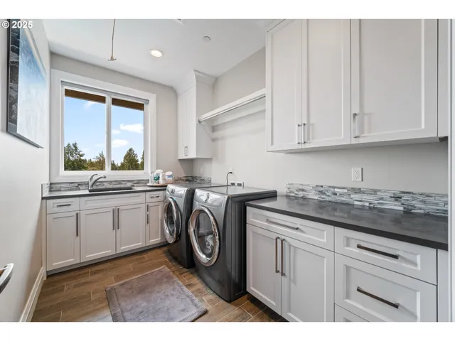 a kitchen with sink cabinets and window