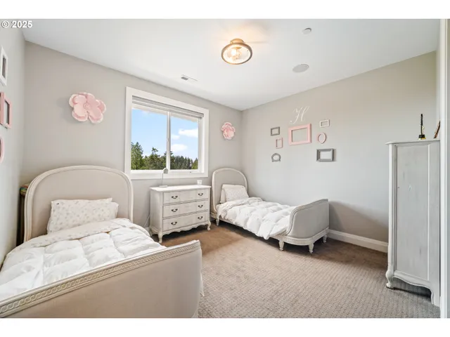 a bedroom with bed and window