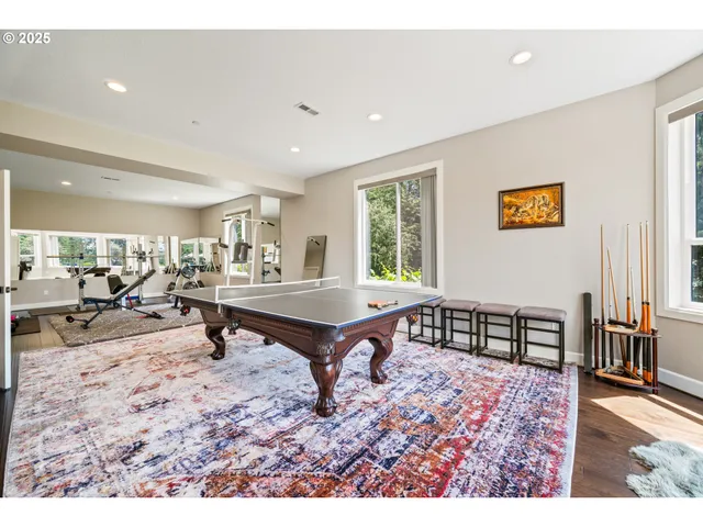 a living room with furniture a window and a flat screen tv