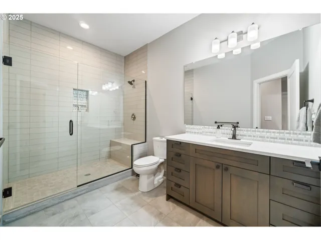 a bathroom with a sink double vanity and a mirror