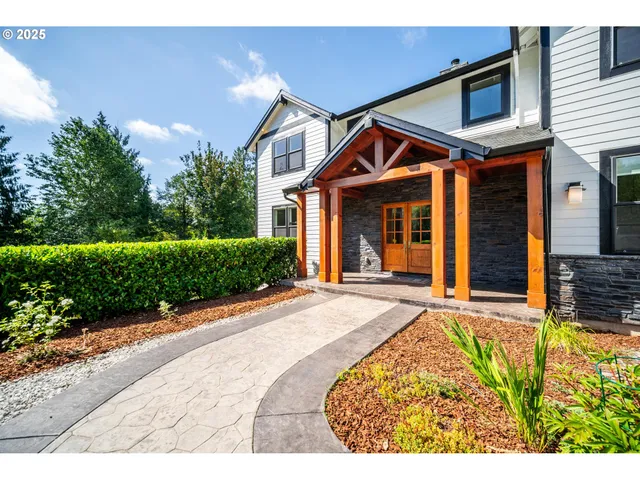 a front view of a house with garden