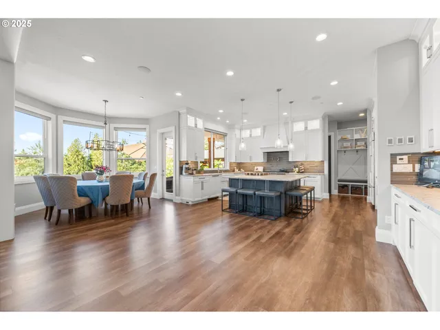a kitchen with lots of counter top space and stainless steel appliances