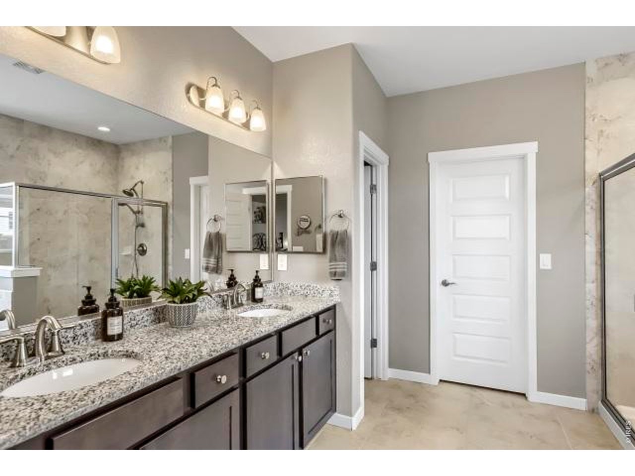 2169 Day Spring Drive Windsor, CO 80550 - Photo 14 of 39 a bathroom with a double vanity sink and a mirror