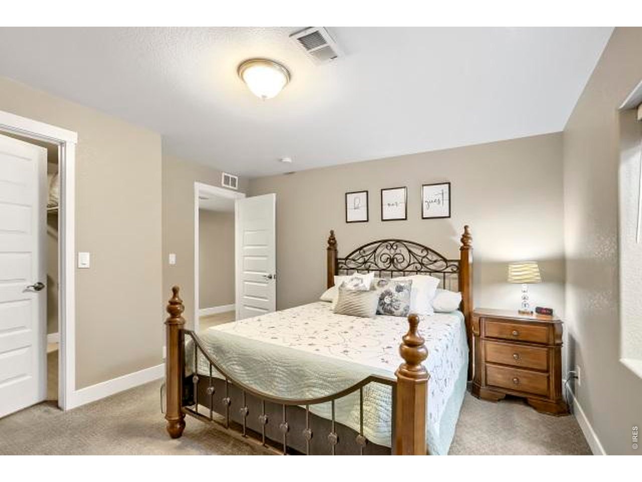 2169 Day Spring Drive Windsor, CO 80550 - Photo 25 of 39 a bedroom with a bed and a table in it