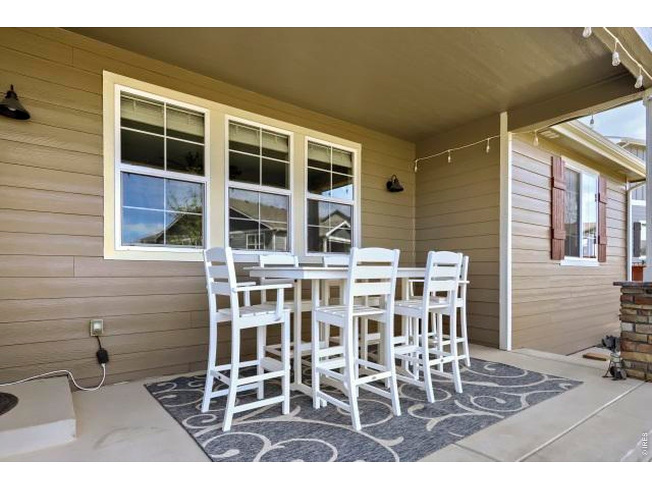 2169 Day Spring Drive Windsor, CO 80550 - Photo 31 of 39 a balcony with table and chairs