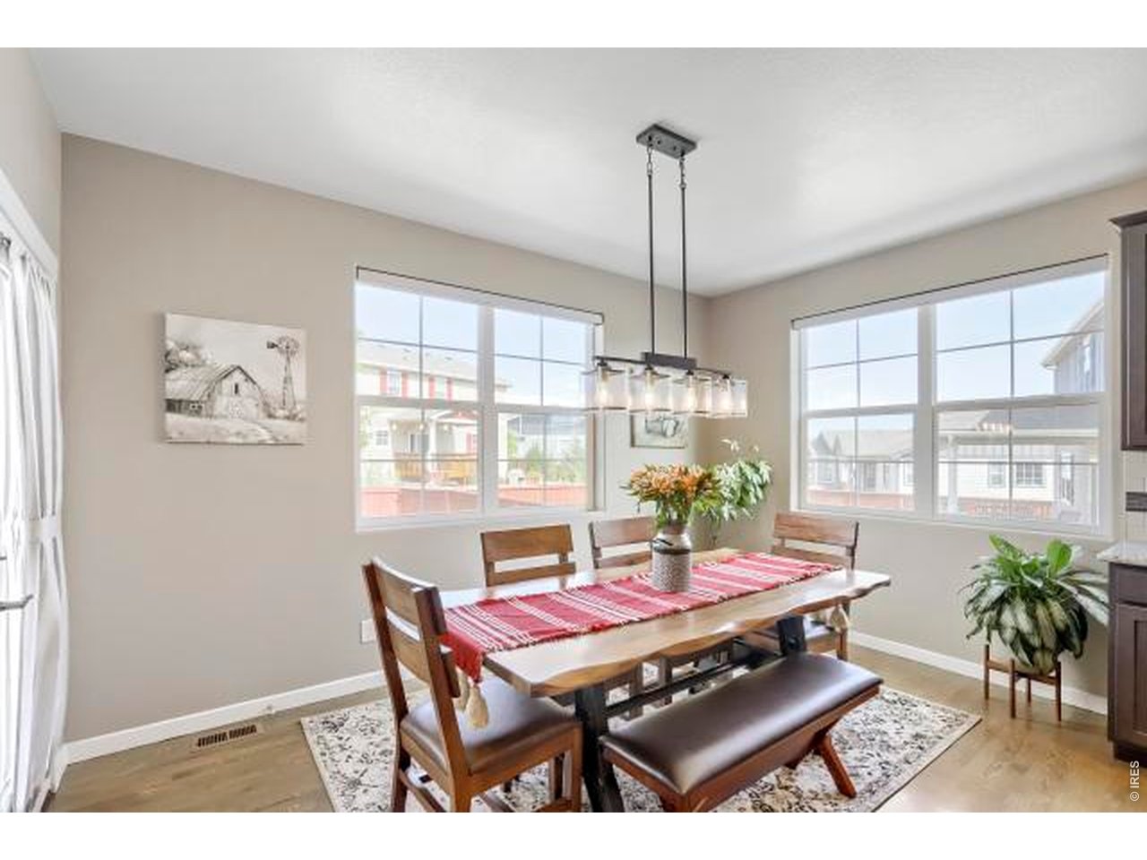 2169 Day Spring Drive Windsor, CO 80550 - Photo 7 of 39 a view of a dining room with furniture window and wooden floor