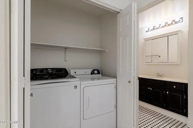 a utility room with dryer and washer