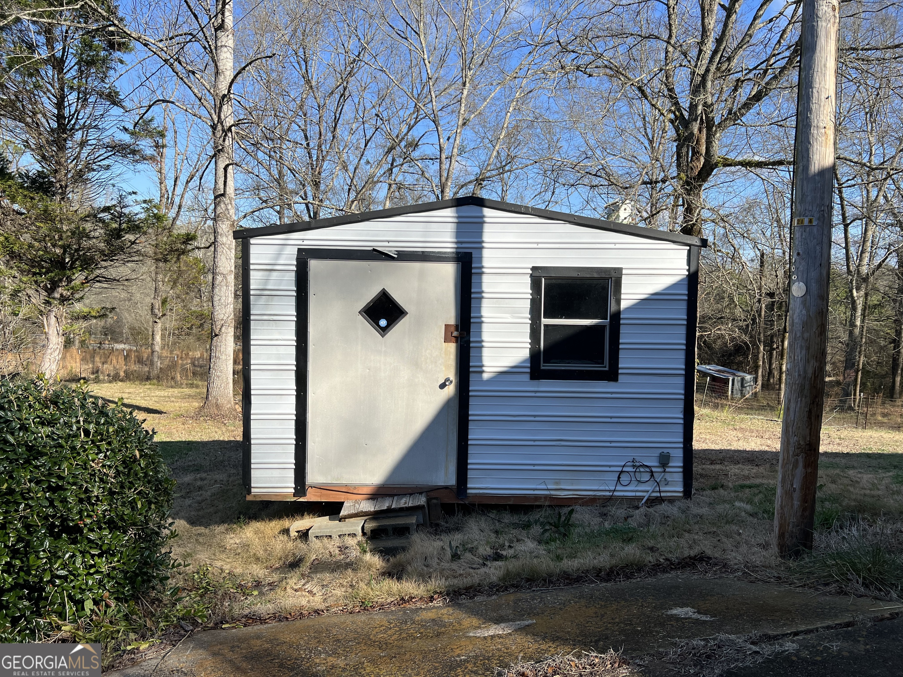 1567 Locust Grove Road Locust Grove, GA 30248 - Photo 12 of 33 a front view of a house with garden