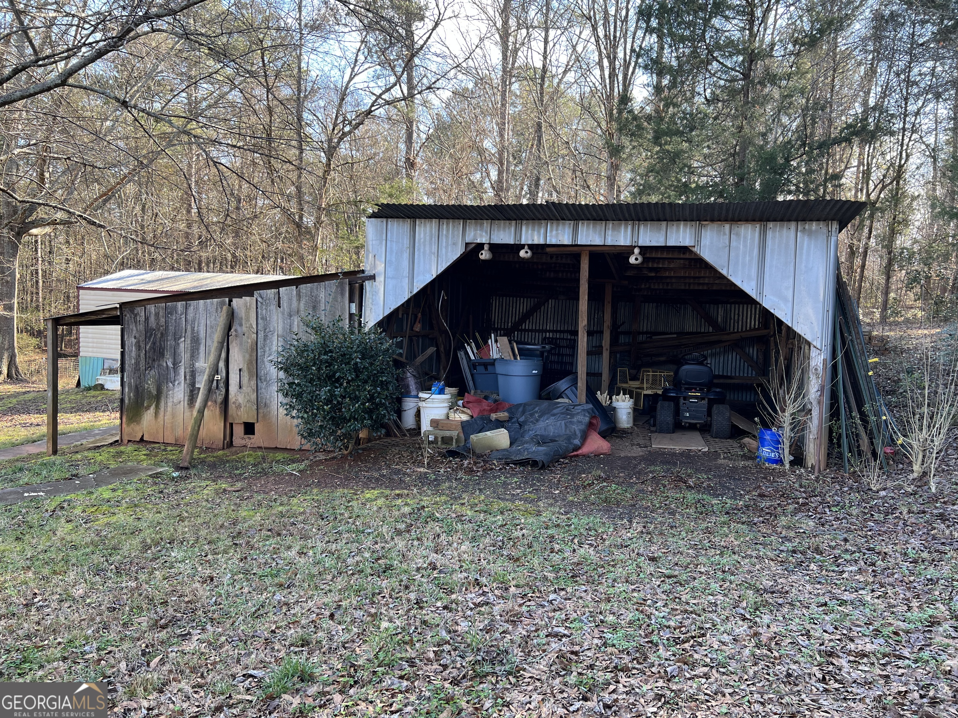 1567 Locust Grove Road Locust Grove, GA 30248 - Photo 13 of 33 a view of a car parked in a yard