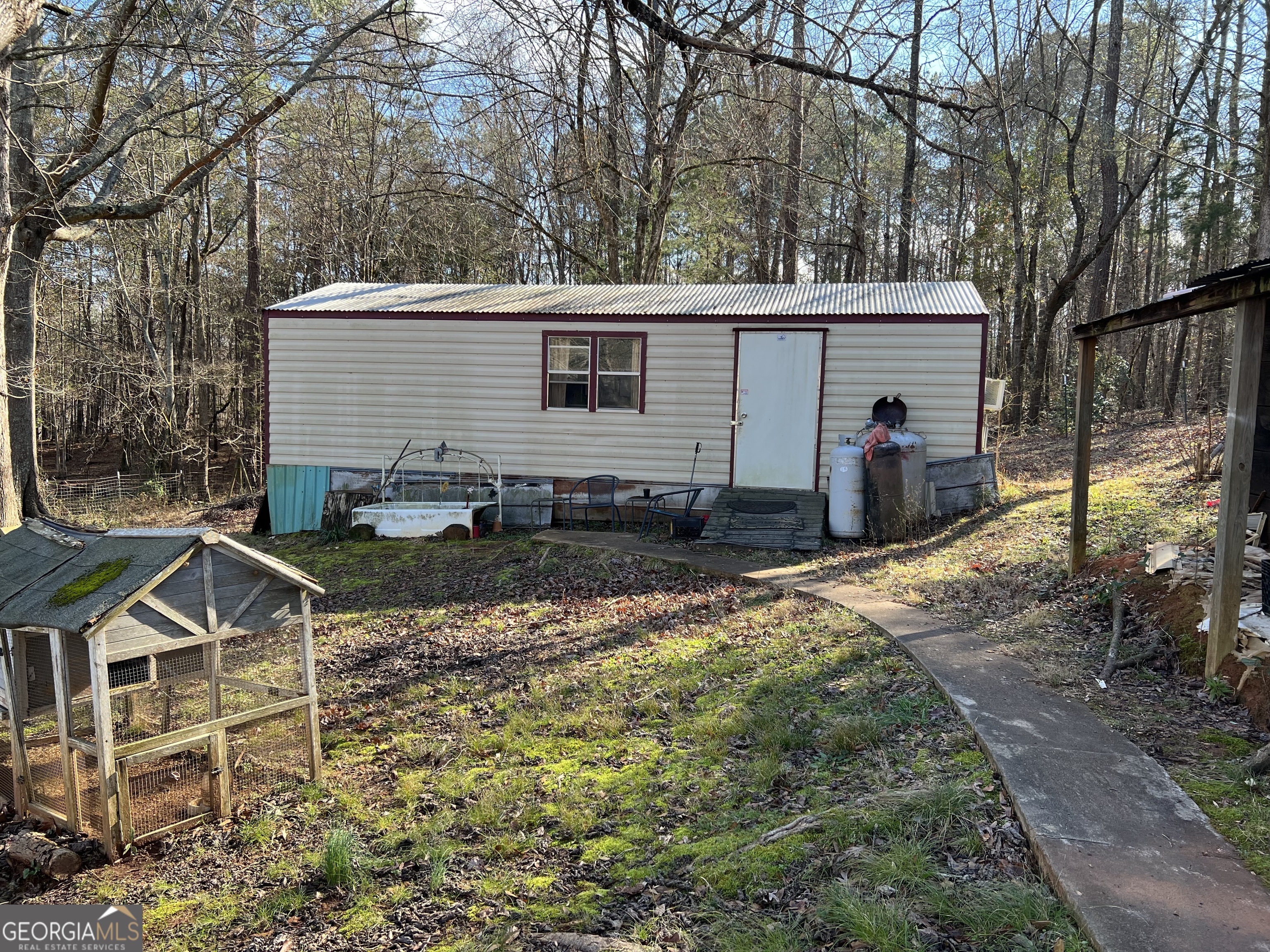 1567 Locust Grove Road Locust Grove, GA 30248 - Photo 14 of 33 a view of a house with backyard and sitting area