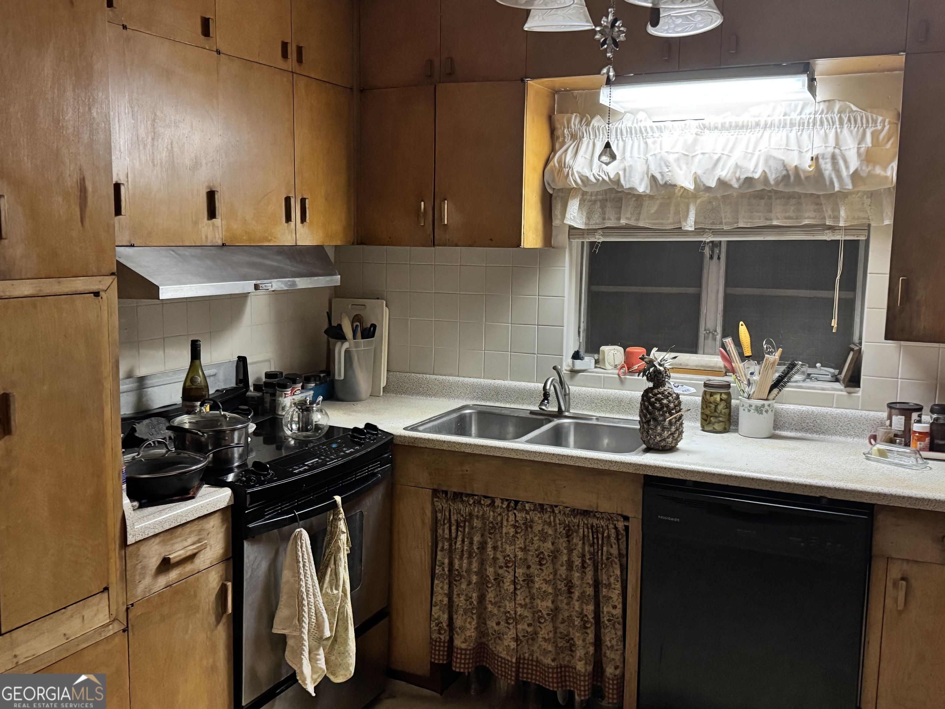 1567 Locust Grove Road Locust Grove, GA 30248 - Photo 23 of 33 a kitchen with a sink and cabinets