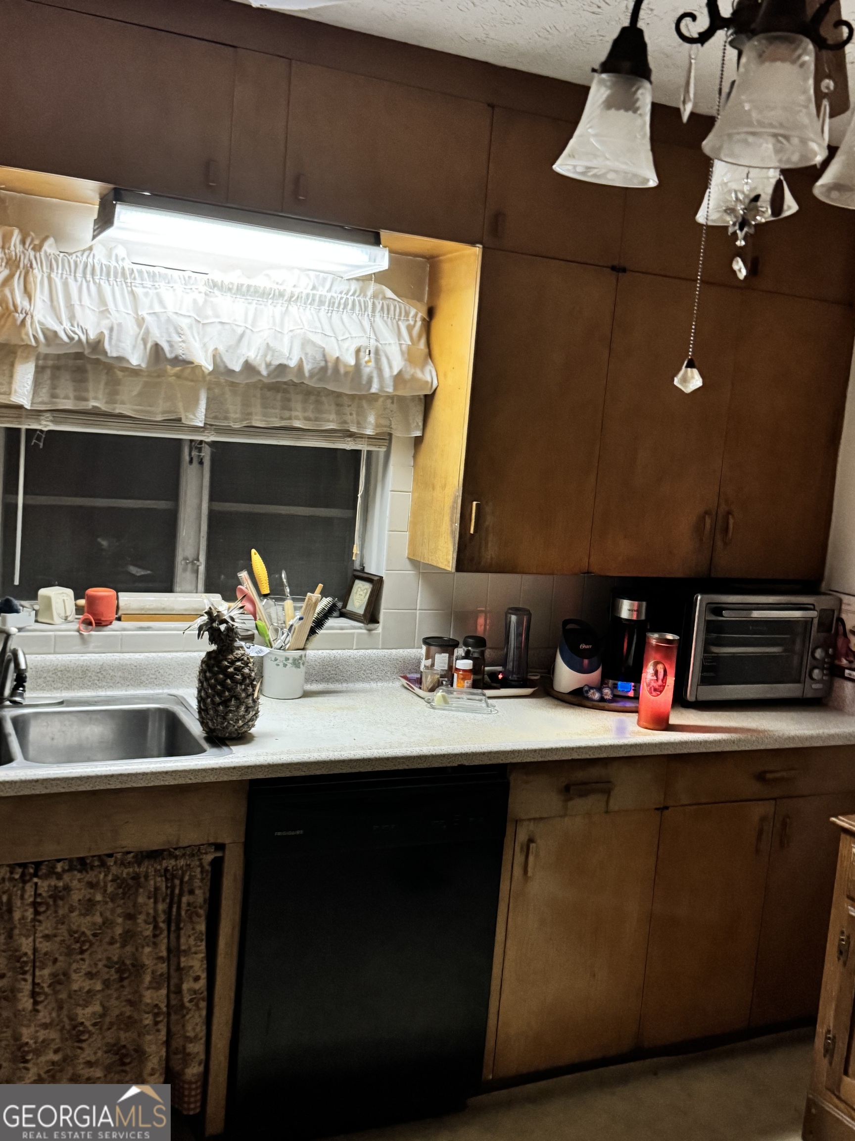 1567 Locust Grove Road Locust Grove, GA 30248 - Photo 24 of 33 a kitchen with a sink and a stove