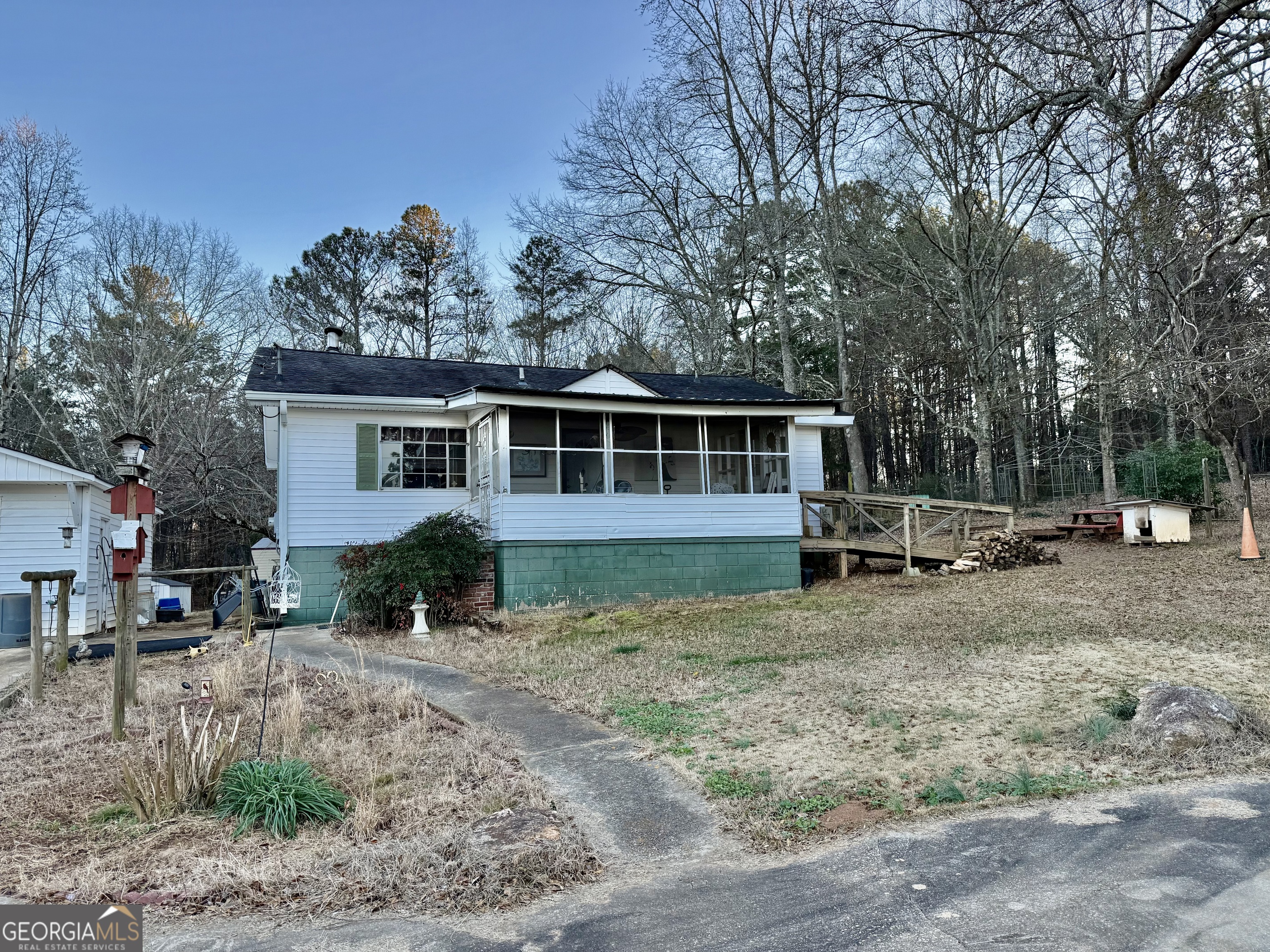 1567 Locust Grove Road Locust Grove, GA 30248 - Photo 4 of 33 a view of a house with a yard and sitting area