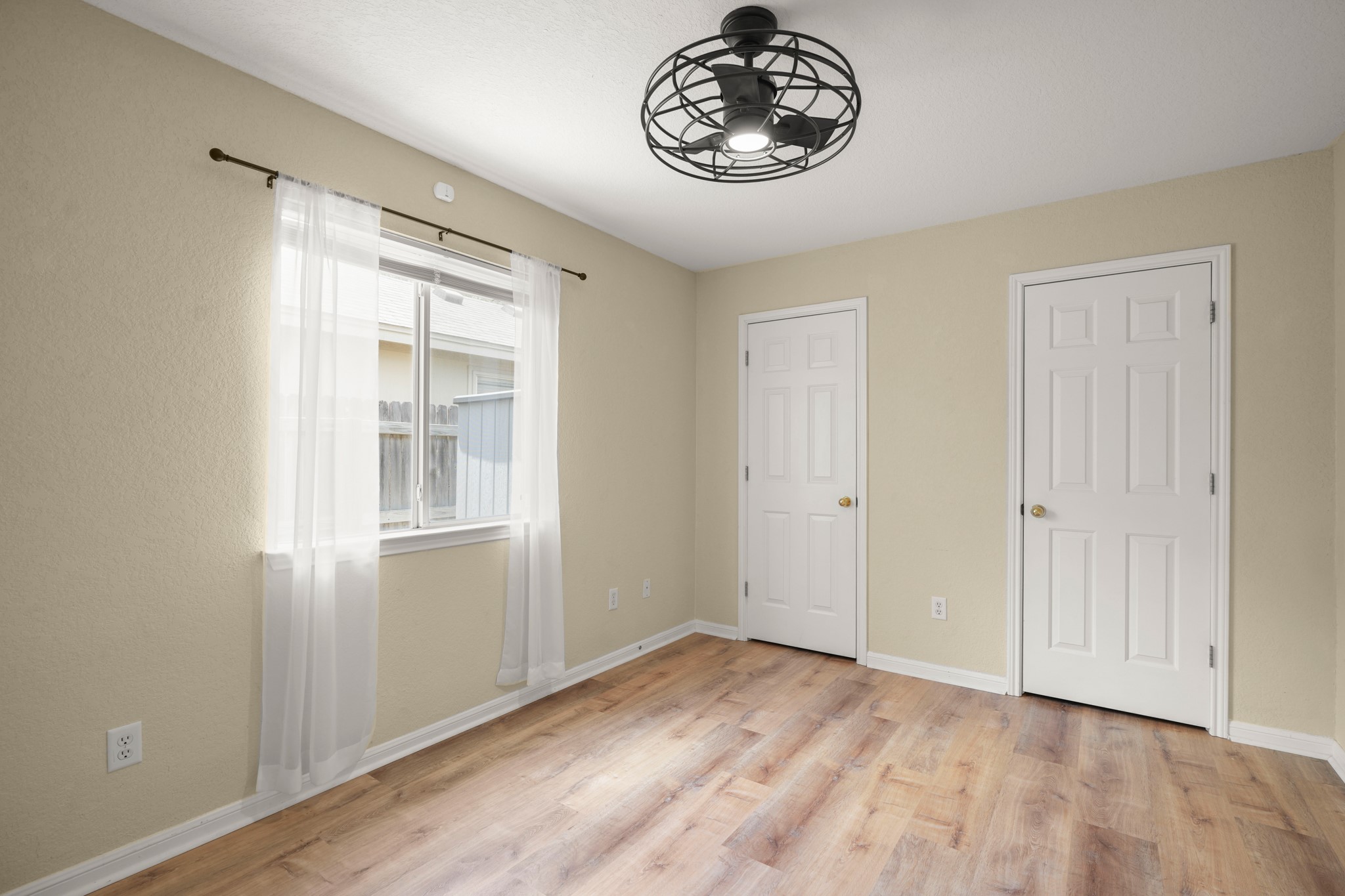 438 Katy Crossing Georgetown, TX 78626 - Photo 19 of 24 Natural light filters into this bedroom, featuring light-toned flooring and dual pane windows.