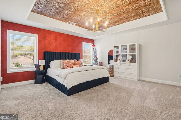 a bed sitting in a room next to a window