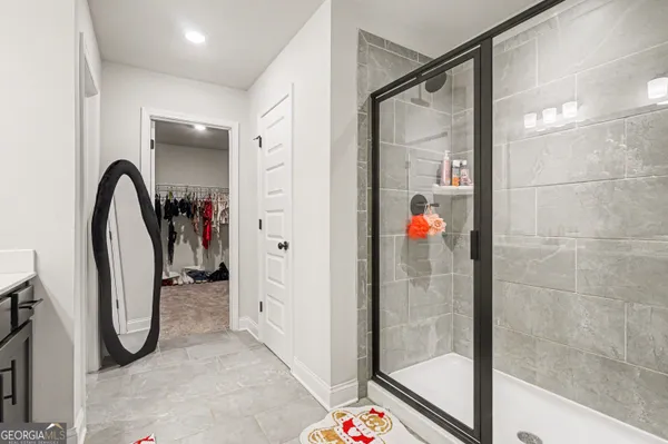 a bathroom with a sink mirror vanity and toilet