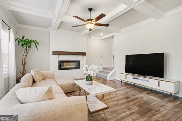 a living room with furniture and a flat screen tv