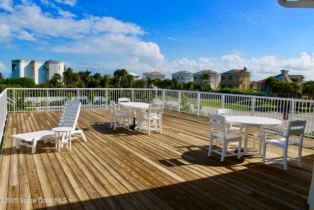 an aerial view of a house with a garden and trees
