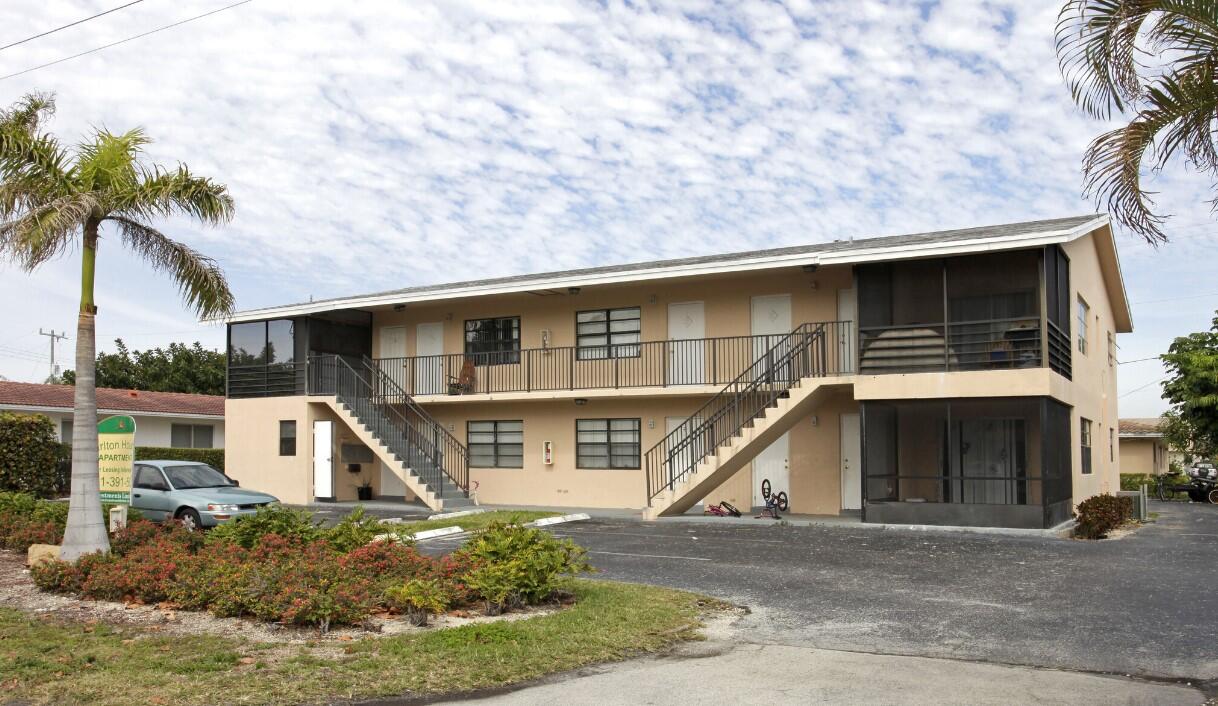 559 Northeast 44th Street, Unit 3 Boca Raton, FL 33431 - Photo 1 of 1 a front view of a house with a yard