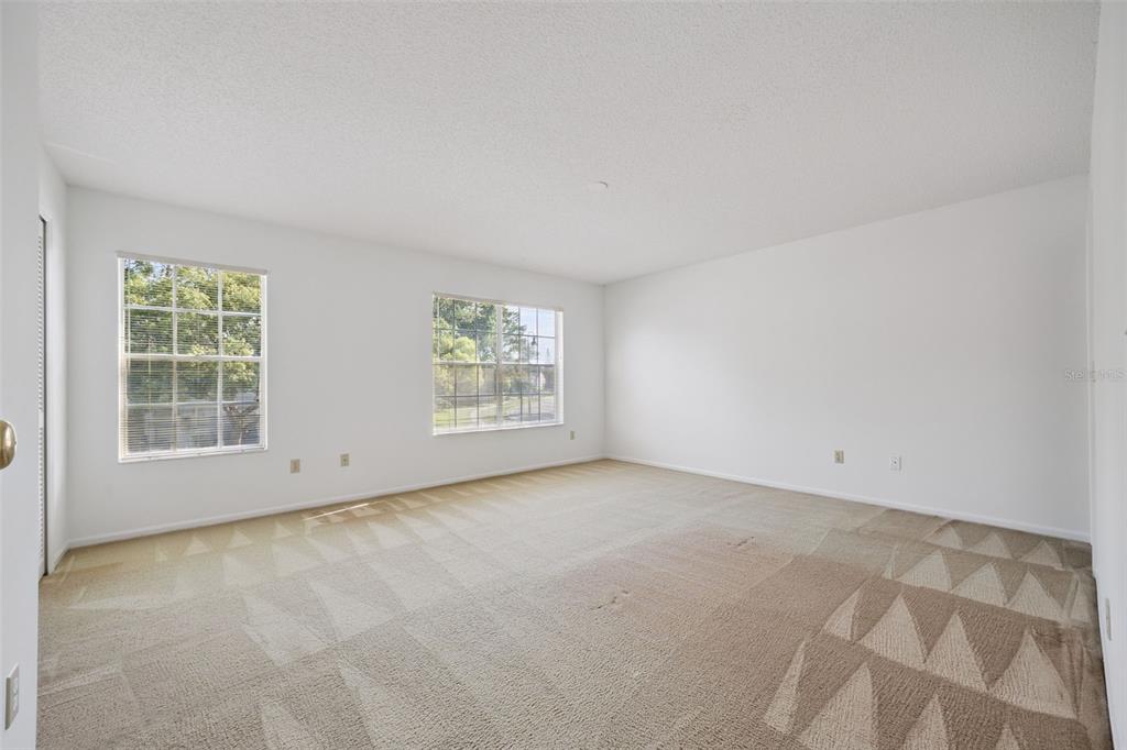 498 Green Spring Circle Winter Springs, FL 32708 - Photo 11 of 20 an empty room with windows