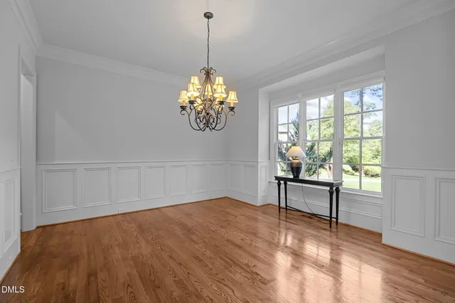 a kitchen with stainless steel appliances granite countertop hardwood floor sink stove and wooden floor