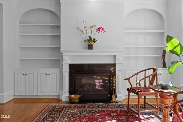 a living room filled with furniture and a floor to ceiling window