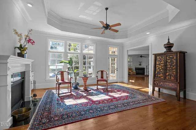 a view of patio with a table and chairs under an umbrella