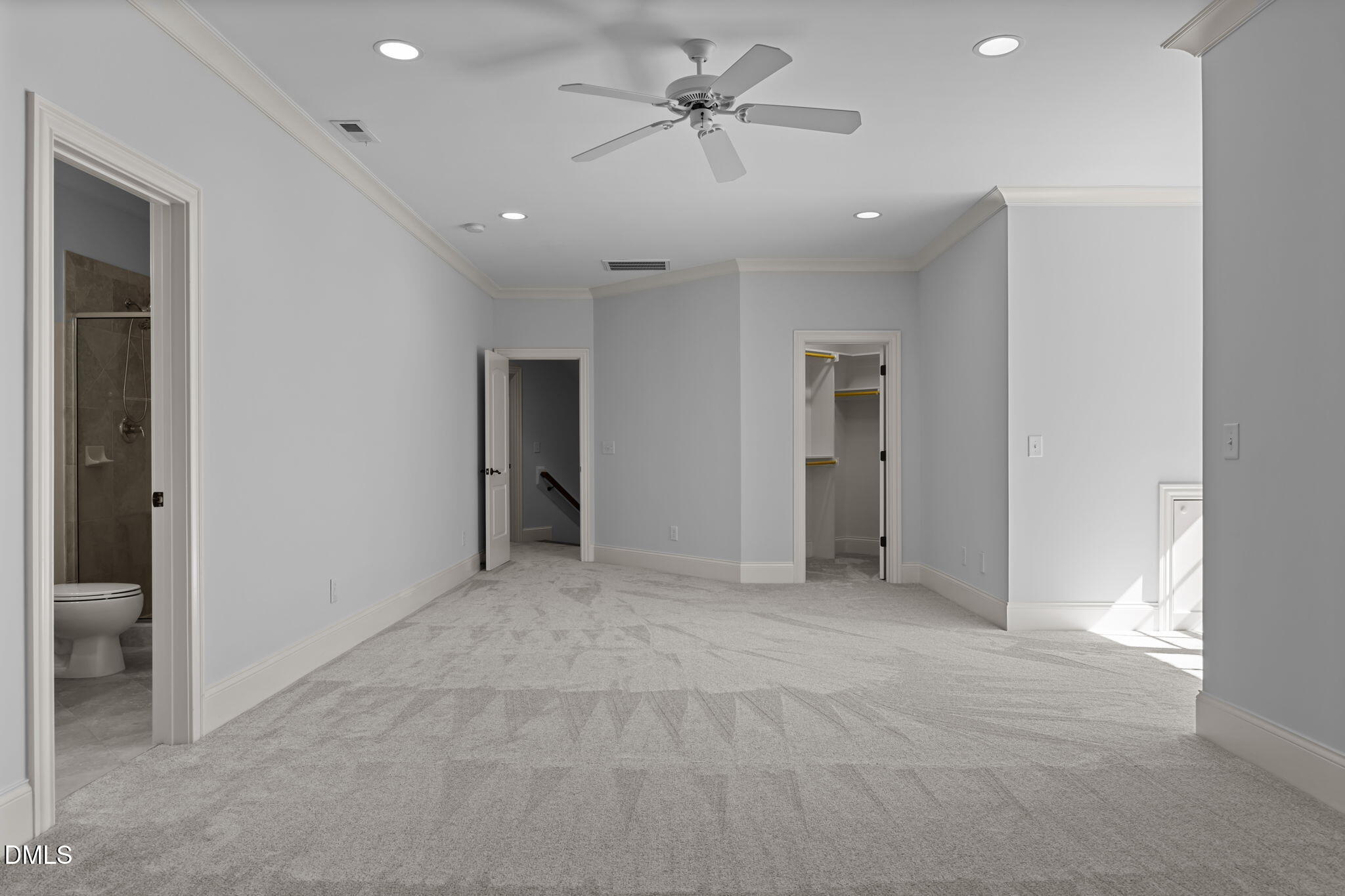 10101 Lobley Hill Lane Raleigh, NC 27613 - Photo 45 of 89 a view of a big room with a ceiling fan and entryway