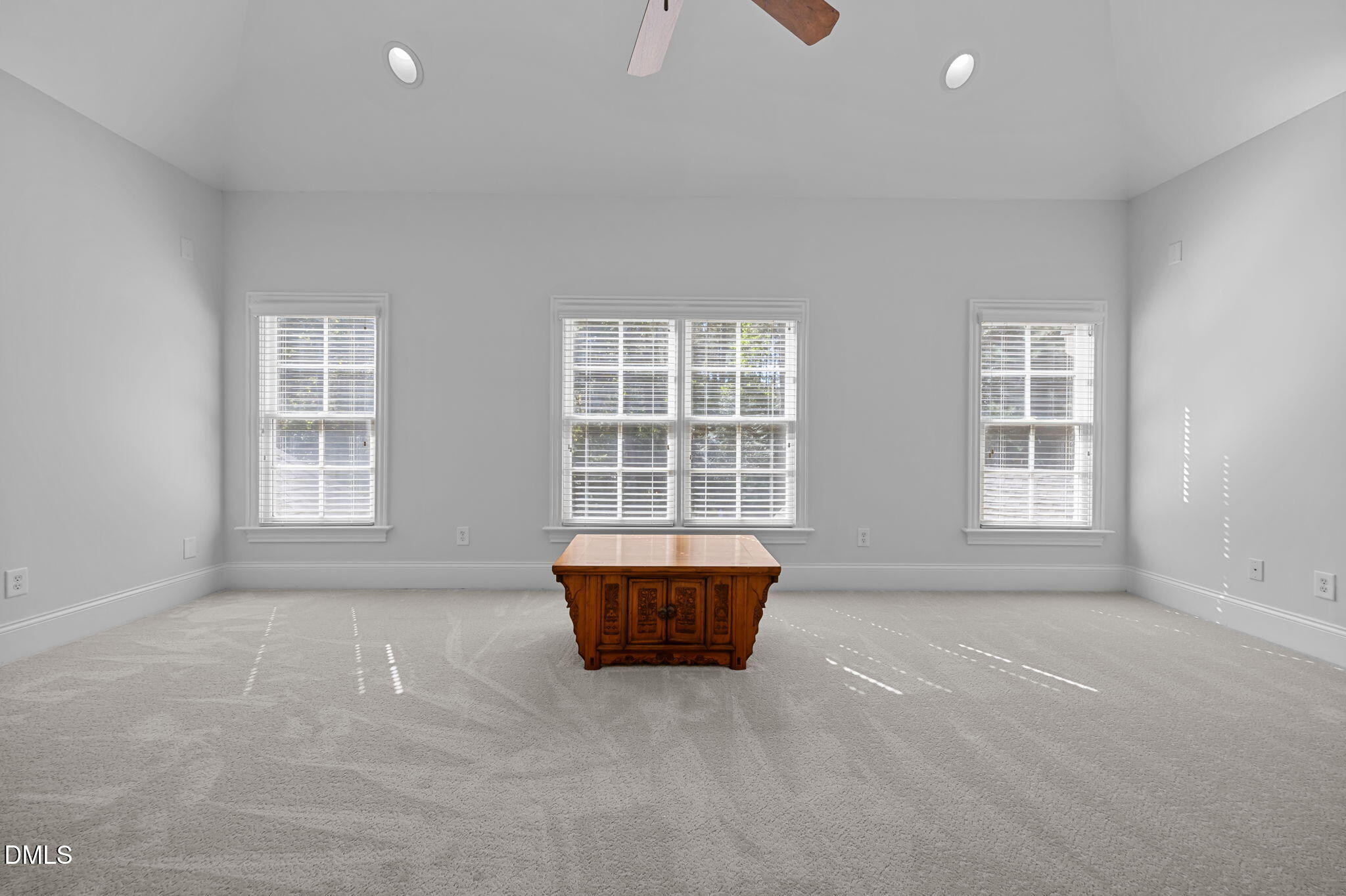 10101 Lobley Hill Lane Raleigh, NC 27613 - Photo 49 of 89 an empty room with a window and a couch