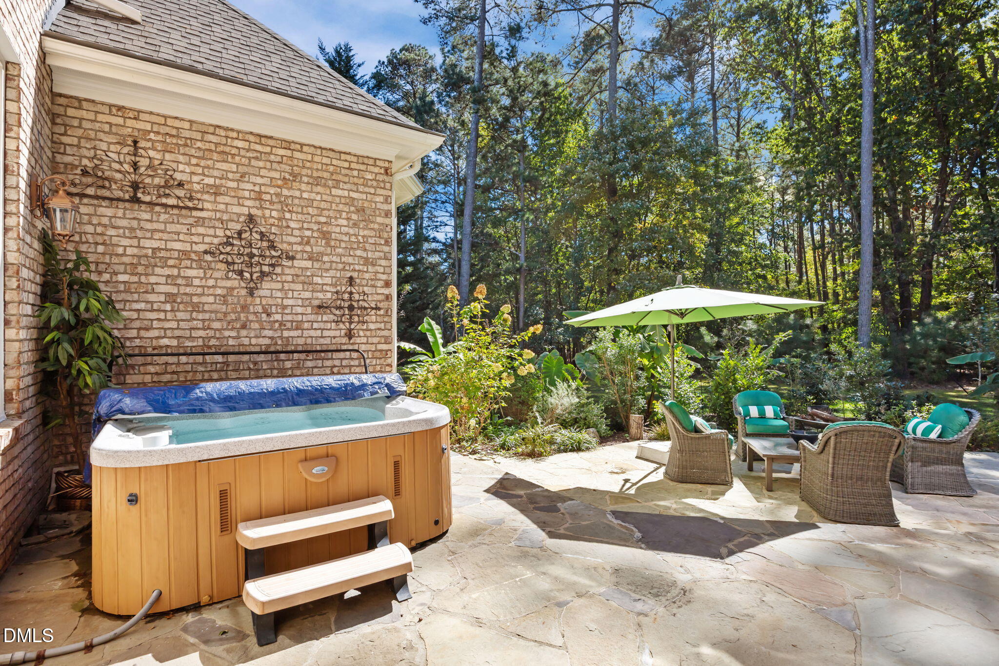 10101 Lobley Hill Lane Raleigh, NC 27613 - Photo 73 of 89 a view of patio with a table and chairs under an umbrella