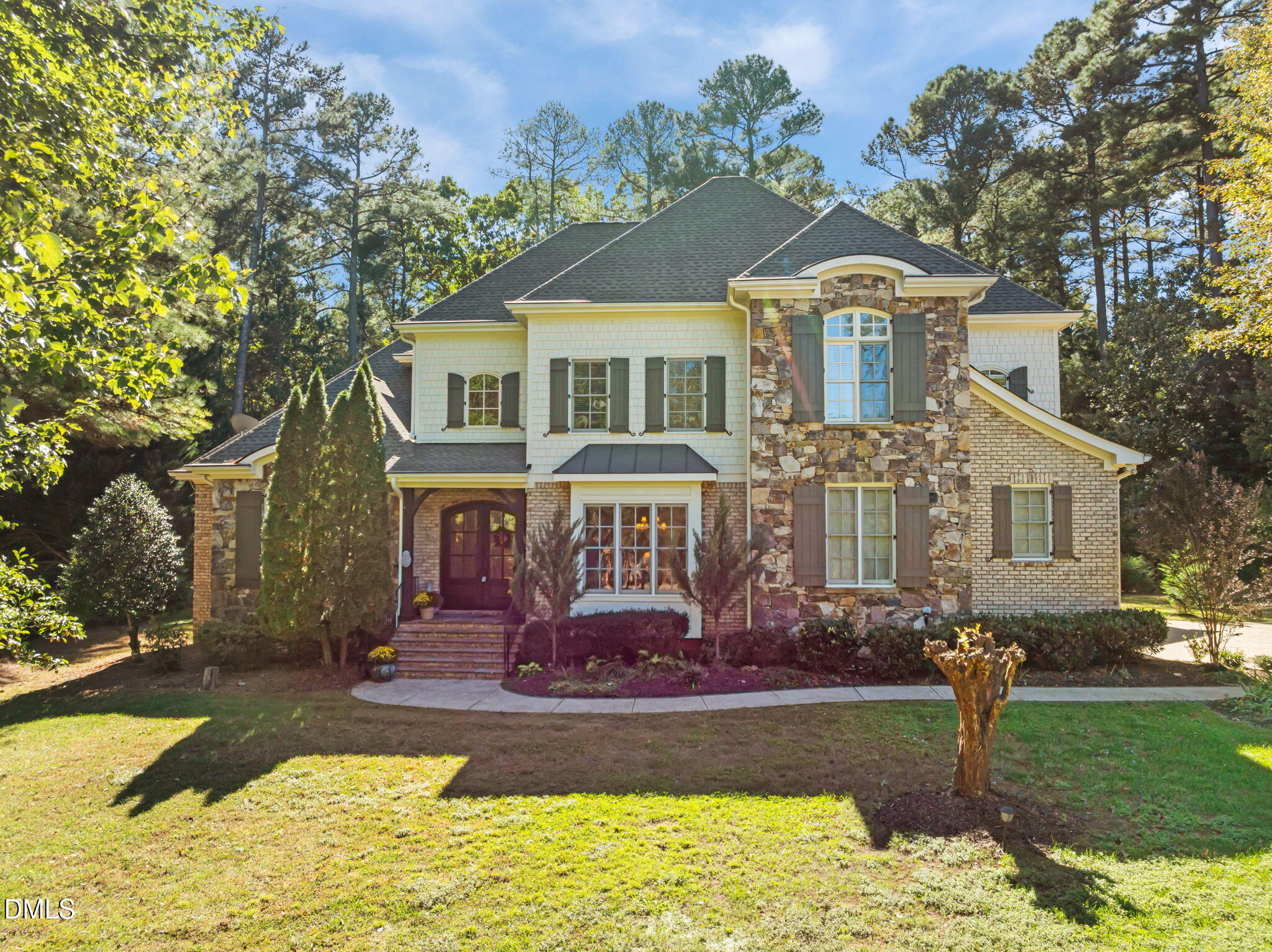 10101 Lobley Hill Lane Raleigh, NC 27613 - Photo 80 of 89 a front view of a house with a yard
