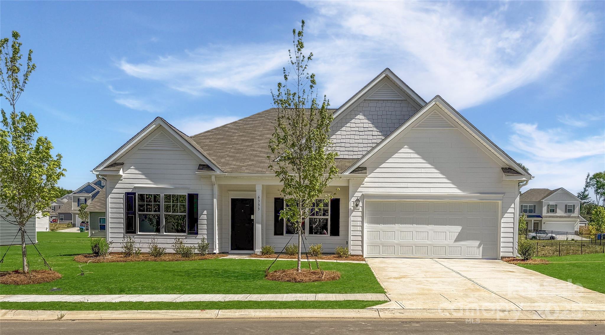 6209 Busch Way Midland, NC 28107 - Photo 1 of 17 a view of a house with a yard and large tree