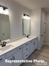 6209 Busch Way Midland, NC 28107 - Photo 14 of 17 a bathroom with a double vanity sink and a mirror