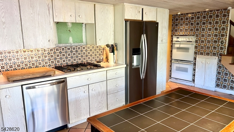21 Payne Road Newton, NJ 07860 - Photo 12 of 29 a kitchen with stainless steel appliances a refrigerator sink and cabinets