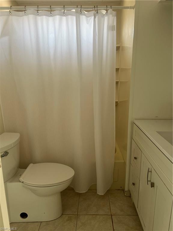 777 Walkerbilt Road, Unit 9 Naples, FL 34110 - Photo 7 of 17 a bathroom with a toilet and a shower