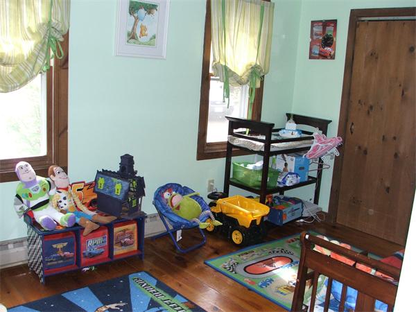 148 Adams Road Oakham, MA 01068 - Photo 11 of 14 a living room with furniture and a window