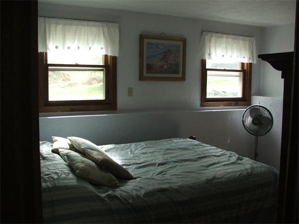 148 Adams Road Oakham, MA 01068 - Photo 14 of 14 a bedroom with a bed and a window