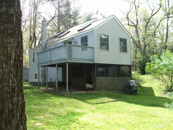 148 Adams Road Oakham, MA 01068 - Photo 5 of 14 a front view of a house with garden