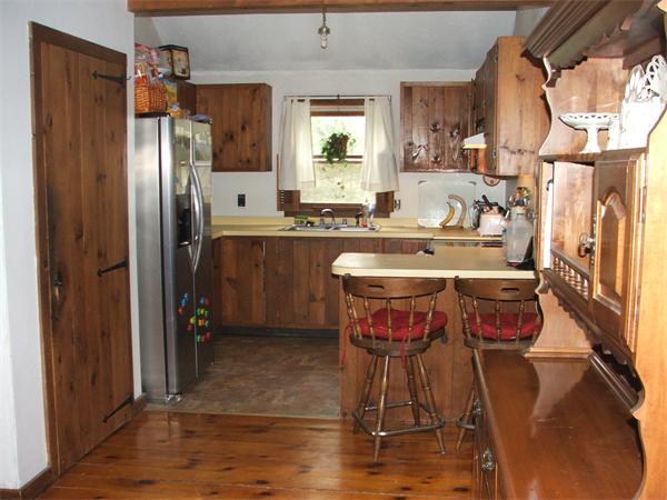 148 Adams Road Oakham, MA 01068 - Photo 10 of 14 a kitchen with stainless steel appliances granite countertop a sink refrigerator and microwave