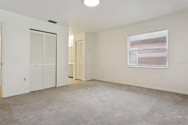 a bathroom with a double vanity sink and a shower