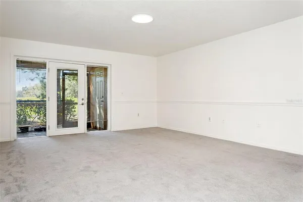 a view of a kitchen cabinets and a window
